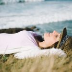 Funky Woman Resting And Relaxing Towards The Sea